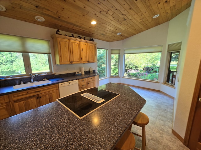 kitchen with dishwasher, wooden ceiling, vaulted ceiling, black electric cooktop, and a kitchen bar