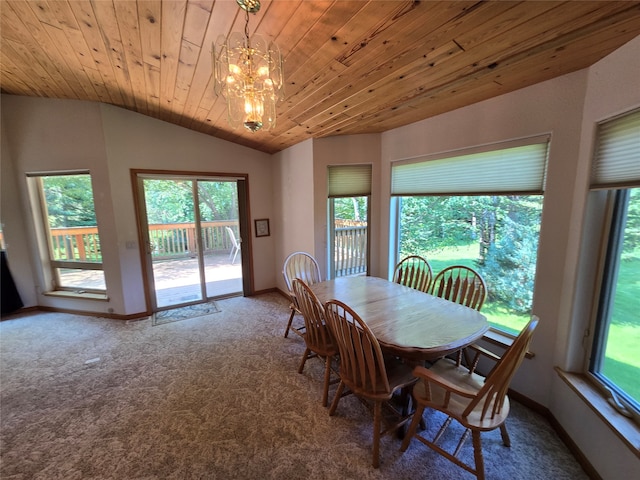 dining area featuring lofted ceiling, carpet flooring, a chandelier, and wooden ceiling