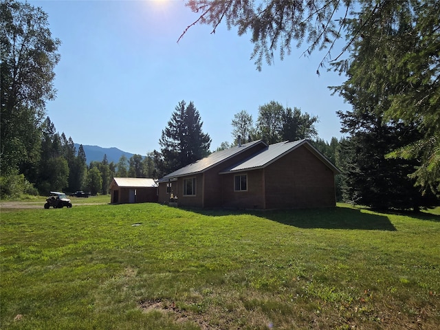 view of side of home featuring a lawn