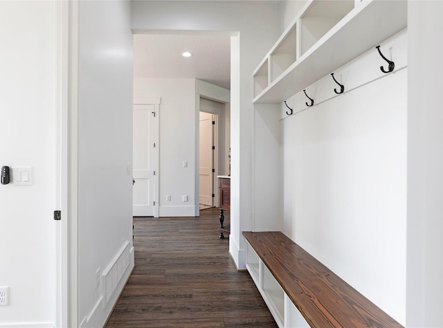 mudroom with dark wood-type flooring, recessed lighting, baseboards, and visible vents