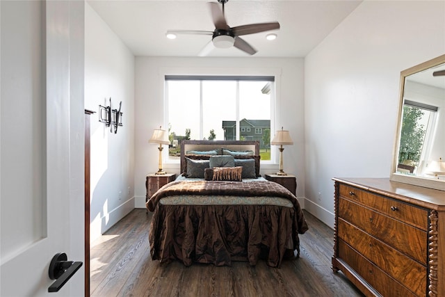 bedroom with recessed lighting, baseboards, dark wood-type flooring, and a ceiling fan