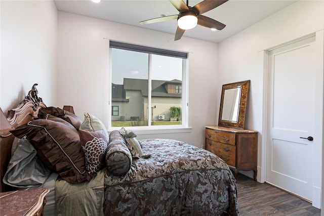 bedroom with dark wood-type flooring and ceiling fan