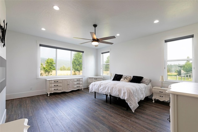 bedroom featuring dark wood-style floors, baseboards, recessed lighting, ceiling fan, and a textured ceiling