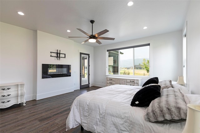 bedroom with recessed lighting, baseboards, and dark wood finished floors