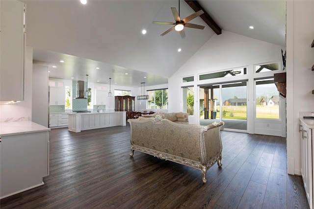 living area featuring beam ceiling, high vaulted ceiling, dark wood finished floors, recessed lighting, and ceiling fan