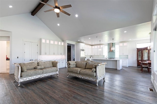 living room with visible vents, dark wood finished floors, beam ceiling, recessed lighting, and high vaulted ceiling