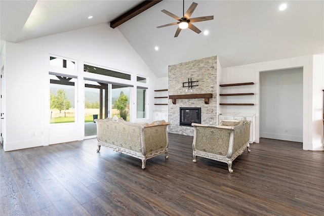 living area featuring wood finished floors, high vaulted ceiling, a fireplace, ceiling fan, and beamed ceiling