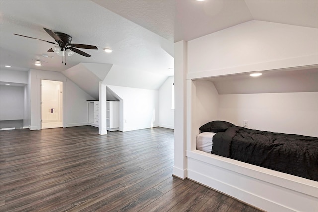 bedroom with recessed lighting, baseboards, dark wood-type flooring, and vaulted ceiling