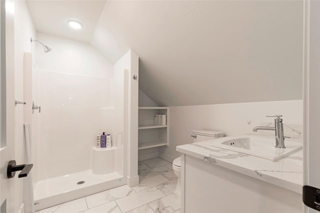 bathroom with toilet, lofted ceiling, a stall shower, marble finish floor, and vanity