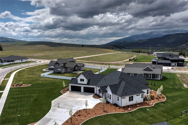 drone / aerial view featuring a mountain view