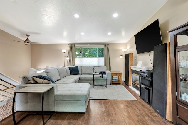 living room with ceiling fan and wood-type flooring