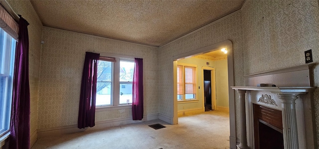 entryway featuring lofted ceiling, crown molding, light carpet, and a textured ceiling