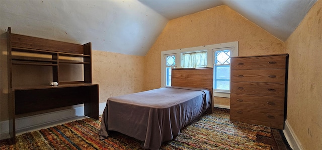 bedroom featuring lofted ceiling