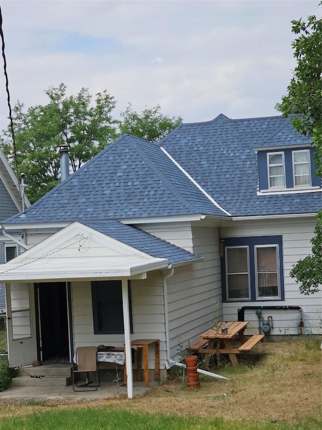 back of property featuring a patio