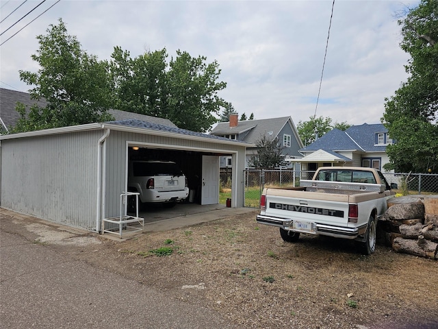 view of side of home with an outbuilding and a garage