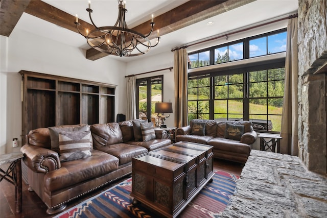 living room with beam ceiling, a notable chandelier, a towering ceiling, and hardwood / wood-style flooring