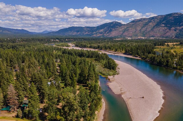 659 US Highway 2 E, Columbia Falls, MT 59912 - drone / aerial view featuring a view of trees and a water and mountain view