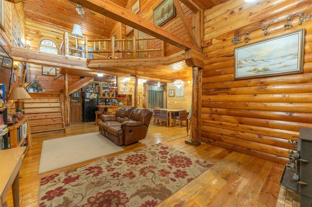659 US Highway 2 E, Columbia Falls, MT 59912 - living area featuring wood ceiling, beam ceiling, high vaulted ceiling, and hardwood / wood-style floors