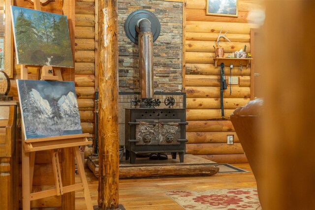659 US Highway 2 E, Columbia Falls, MT 59912 - interior space with rustic walls, wood finished floors, and a wood stove