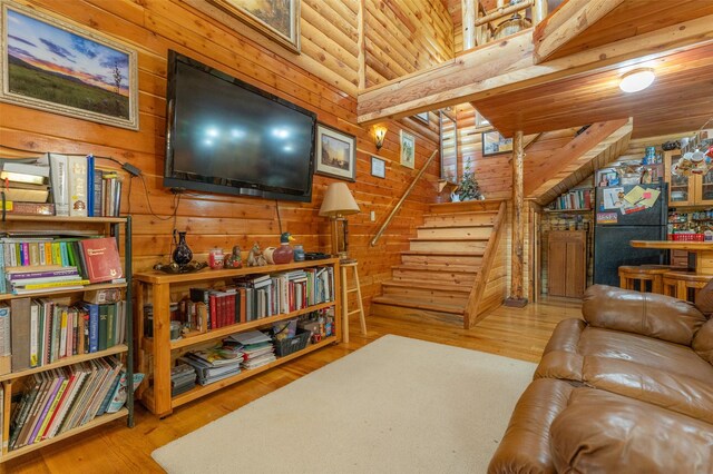 659 US Highway 2 E, Columbia Falls, MT 59912 - living area featuring stairs, wood finished floors, and wooden walls