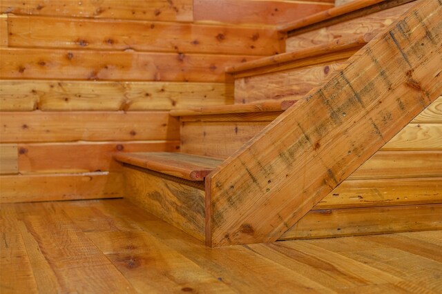 659 US Highway 2 E, Columbia Falls, MT 59912 - stairway featuring rustic walls, wood-type flooring, and a sauna