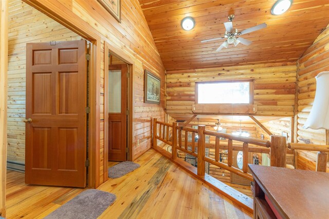 659 US Highway 2 E, Columbia Falls, MT 59912 - interior space featuring lofted ceiling, light wood finished floors, wood ceiling, and log walls