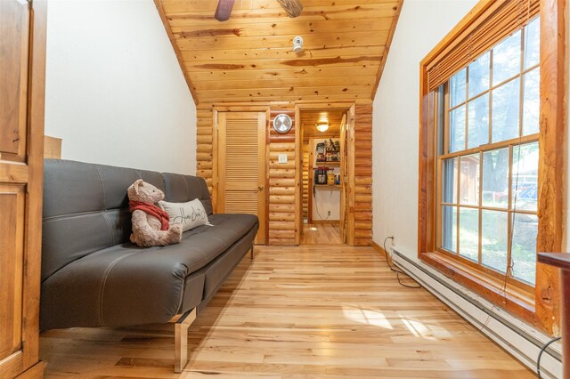 659 US Highway 2 E, Columbia Falls, MT 59912 - sitting room with lofted ceiling, wooden ceiling, light wood-style flooring, and a baseboard heating unit