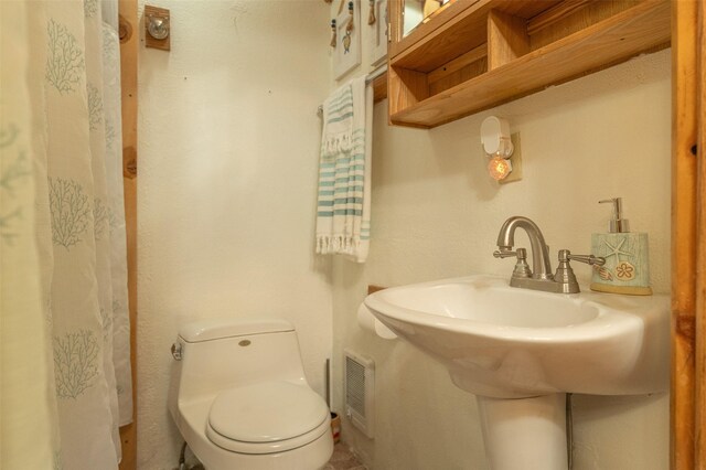 659 US Highway 2 E, Columbia Falls, MT 59912 - bathroom featuring toilet and visible vents