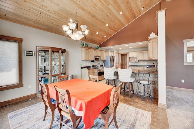 dining room featuring wooden ceiling, high vaulted ceiling, a chandelier, light tile patterned floors, and sink