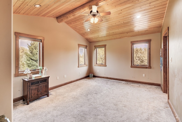 carpeted spare room featuring wooden ceiling, lofted ceiling with beams, and ceiling fan