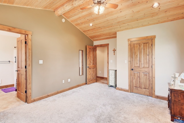 unfurnished bedroom with wooden ceiling, lofted ceiling with beams, ceiling fan, and light carpet