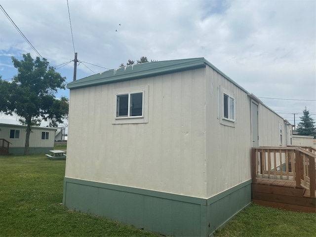 view of home's exterior with a yard