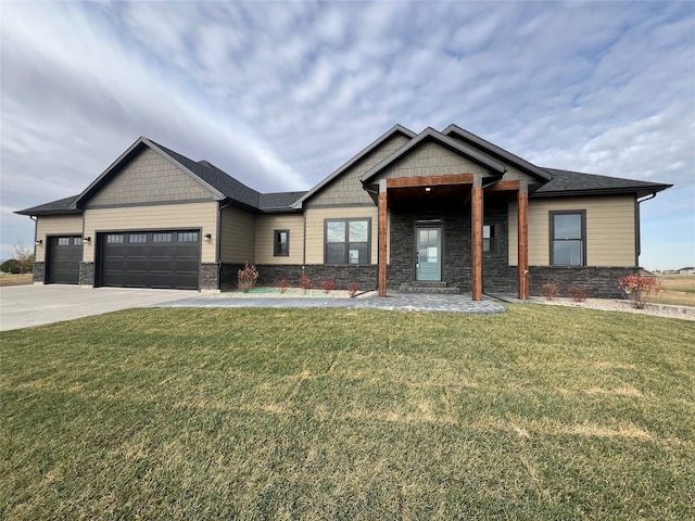 craftsman-style home with a garage and a front yard