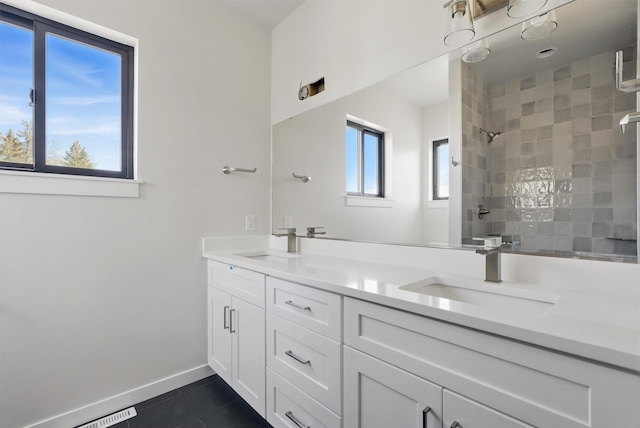 940 Kemp St Unit A, Missoula, MT 59801 - full bathroom with tile patterned flooring, double vanity, and a tile shower