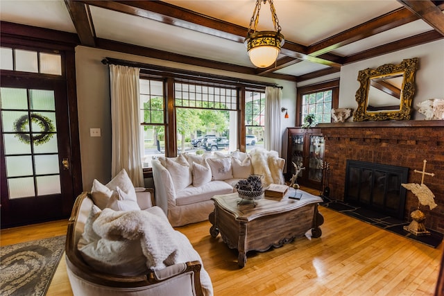 living room with coffered ceiling, beam ceiling, and hardwood / wood-style flooring