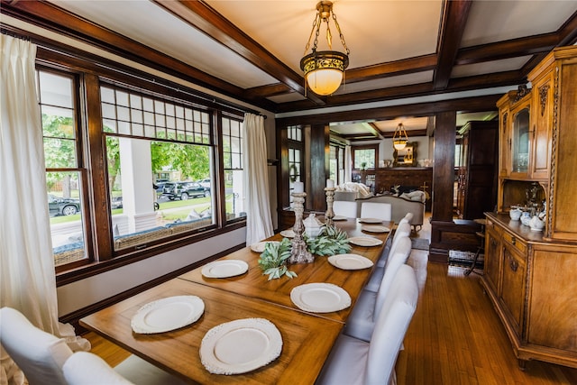 dining room featuring coffered ceiling, beam ceiling, dark hardwood / wood-style flooring, and ornamental molding