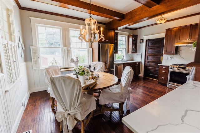 dining space with beam ceiling, plenty of natural light, and dark hardwood / wood-style flooring