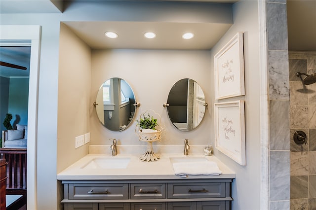 bathroom featuring vanity and tiled shower