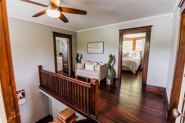 bedroom featuring crown molding, dark hardwood / wood-style floors, and ceiling fan