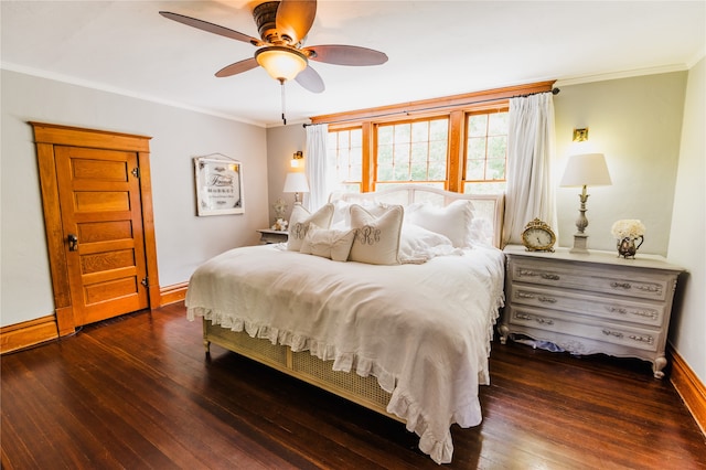 bedroom featuring ceiling fan, crown molding, and dark hardwood / wood-style flooring