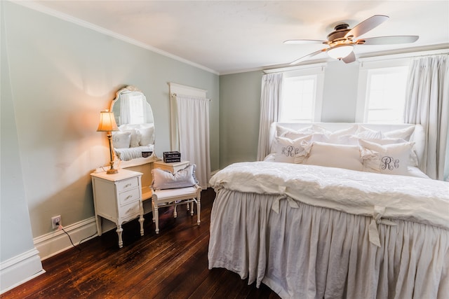 bedroom featuring ornamental molding, ceiling fan, and dark wood-type flooring