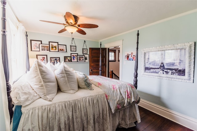 bedroom with ornamental molding, ceiling fan, and dark hardwood / wood-style flooring