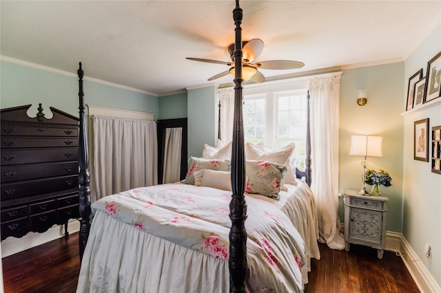 bedroom with ornamental molding, ceiling fan, and dark wood-type flooring