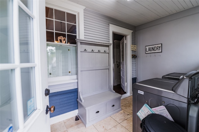 interior space with wood ceiling, tile patterned flooring, and washer and clothes dryer