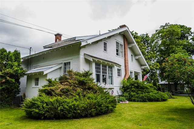 view of property exterior featuring a yard