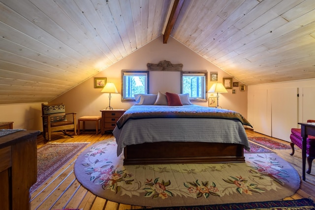 bedroom featuring wooden ceiling, light hardwood / wood-style flooring, and lofted ceiling with beams