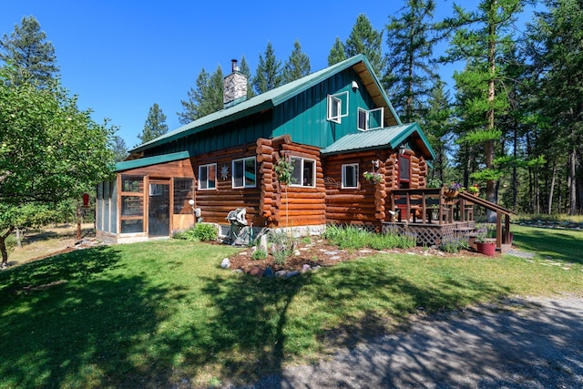 5899 Black Lake Rd, Rexford, MT 59930 - rear view of property with a chimney, a lawn, board and batten siding, and log exterior