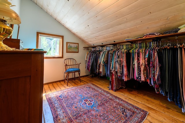 walk in closet featuring lofted ceiling and light hardwood / wood-style floors