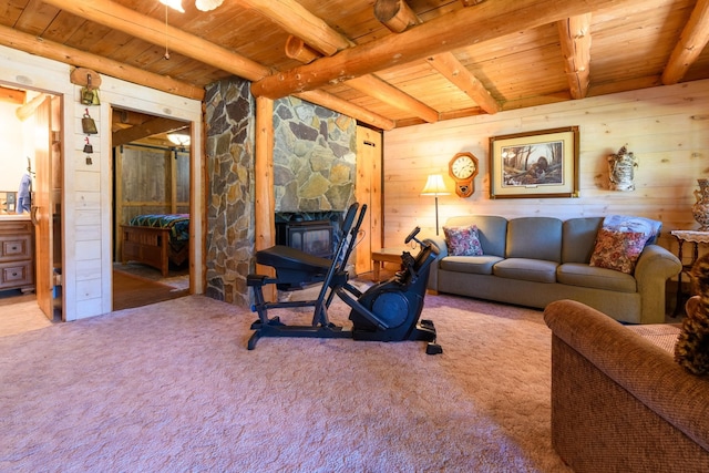 living room with light carpet, wooden walls, beamed ceiling, and wooden ceiling