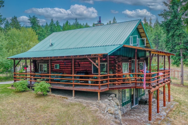 5899 Black Lake Rd, Rexford, MT 59930 - rear view of house featuring log siding and metal roof